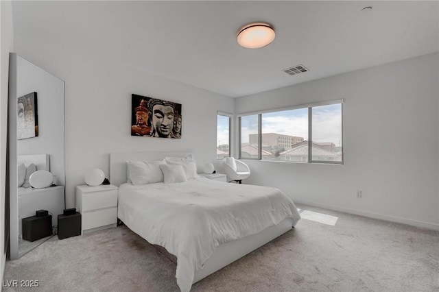 bedroom with visible vents, baseboards, and carpet