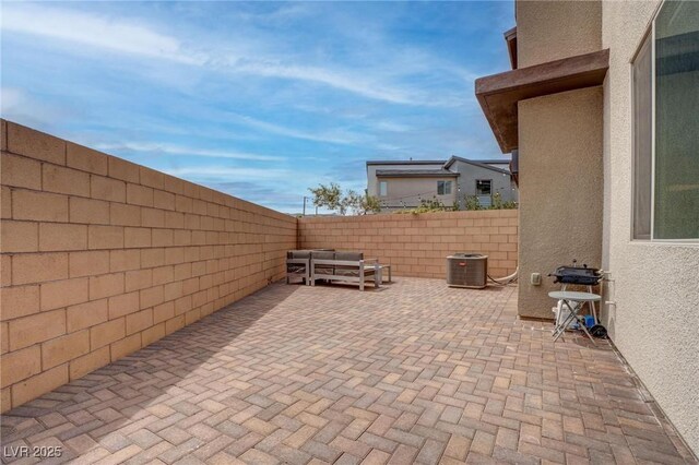 view of patio / terrace with a fenced backyard and cooling unit