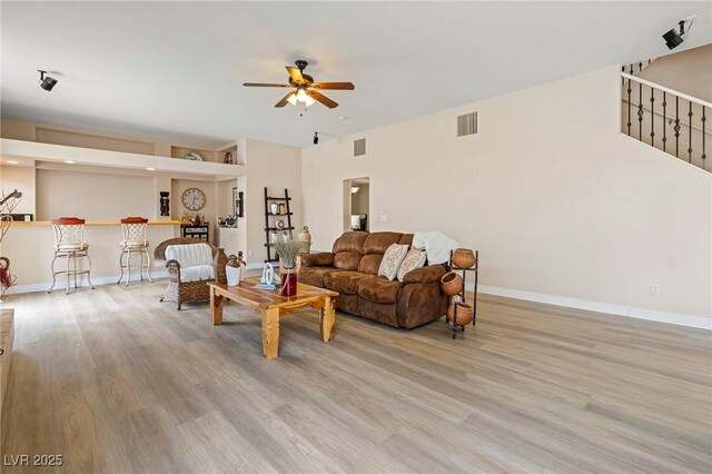 1430 October Oak Ave, Las Vegas, NV 89123 - living area with wood finished floors, ceiling fan, baseboards, and visible vents