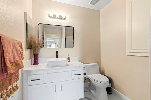 1430 October Oak Ave, Las Vegas, NV 89123 - bathroom with visible vents, baseboards, toilet, vanity, and marble finish floor