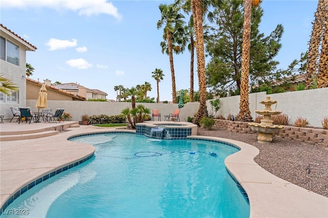 1430 October Oak Ave, Las Vegas, NV 89123 - view of swimming pool featuring a patio area, a pool with connected hot tub, and a fenced backyard