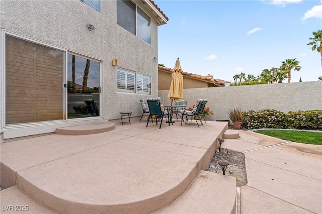1430 October Oak Ave, Las Vegas, NV 89123 - view of patio featuring a fenced backyard and outdoor dining space