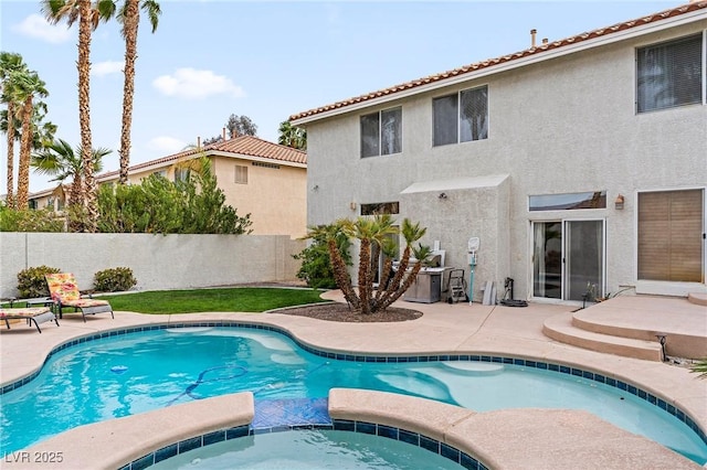 1430 October Oak Ave, Las Vegas, NV 89123 - view of pool with a patio, a fenced backyard, and a pool with connected hot tub