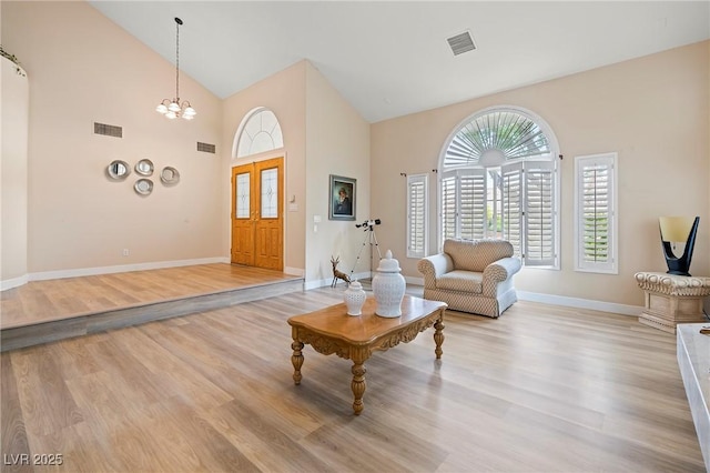 1430 October Oak Ave, Las Vegas, NV 89123 - living room featuring high vaulted ceiling, visible vents, and light wood-style flooring