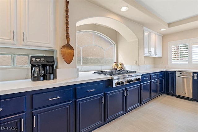 1430 October Oak Ave, Las Vegas, NV 89123 - kitchen with white cabinets, recessed lighting, stainless steel gas cooktop, and blue cabinetry