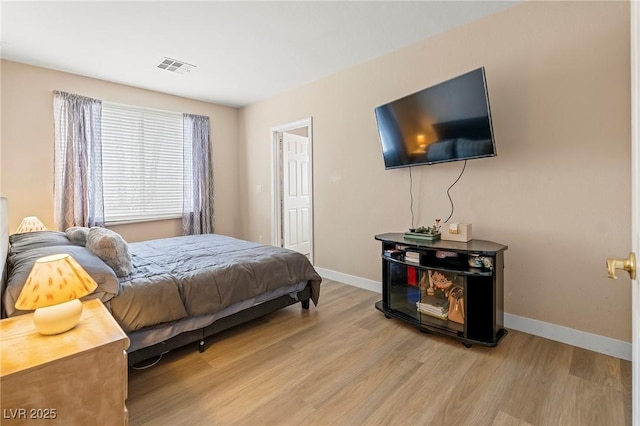 1430 October Oak Ave, Las Vegas, NV 89123 - bedroom featuring light wood finished floors, visible vents, and baseboards