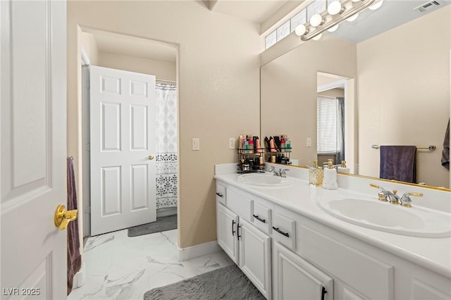 1430 October Oak Ave, Las Vegas, NV 89123 - full bath featuring double vanity, marble finish floor, a sink, and visible vents