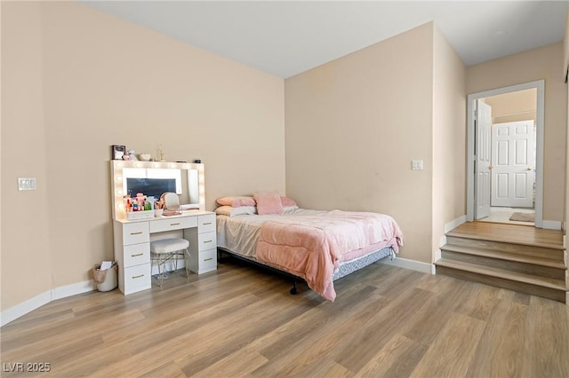 1430 October Oak Ave, Las Vegas, NV 89123 - bedroom with baseboards and light wood finished floors