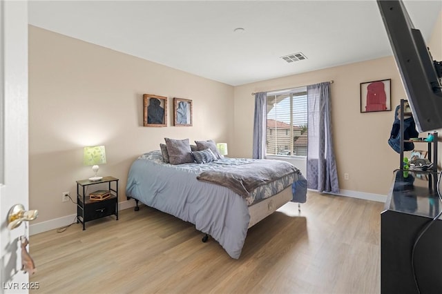 1430 October Oak Ave, Las Vegas, NV 89123 - bedroom with visible vents, baseboards, and light wood-type flooring