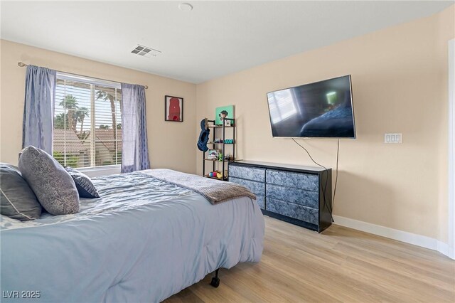 1430 October Oak Ave, Las Vegas, NV 89123 - bedroom with light wood finished floors, baseboards, and visible vents