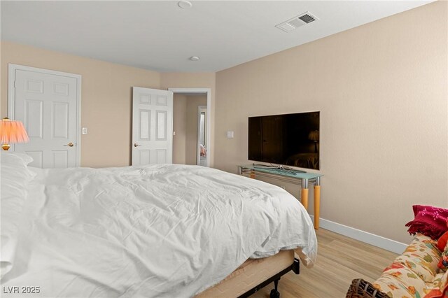 1430 October Oak Ave, Las Vegas, NV 89123 - bedroom featuring visible vents, baseboards, and wood finished floors