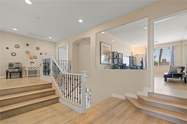 1430 October Oak Ave, Las Vegas, NV 89123 - staircase with recessed lighting, arched walkways, and wood finished floors
