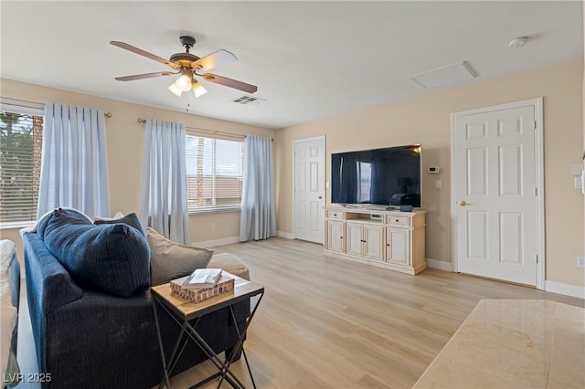 1430 October Oak Ave, Las Vegas, NV 89123 - living area featuring visible vents, ceiling fan, light wood-type flooring, and baseboards