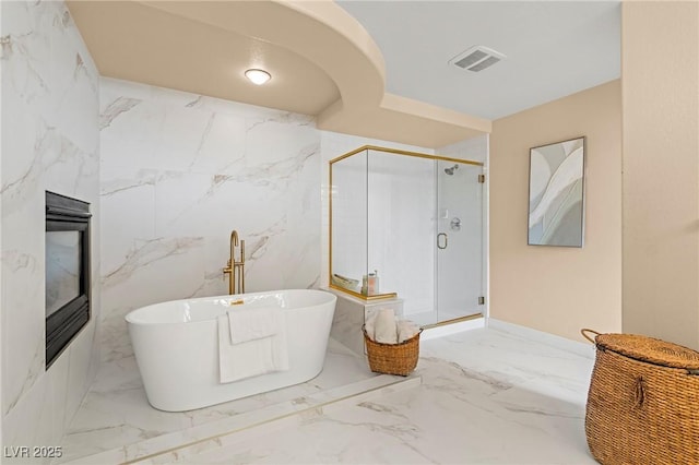 1430 October Oak Ave, Las Vegas, NV 89123 - full bathroom featuring a freestanding bath, visible vents, marble finish floor, and a stall shower