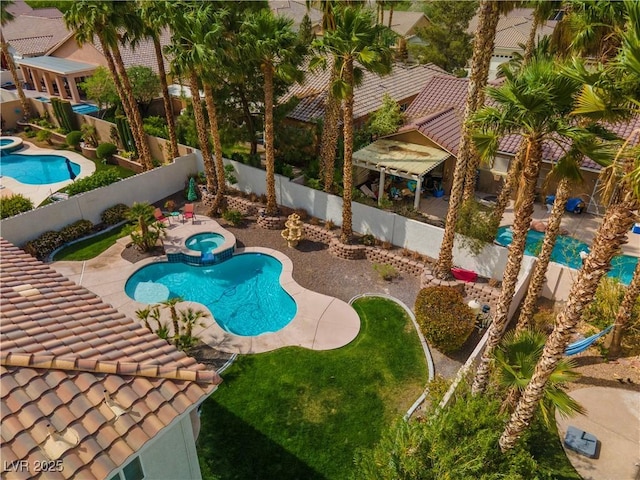 1430 October Oak Ave, Las Vegas, NV 89123 - view of pool with a patio area, a pool with connected hot tub, and a fenced backyard
