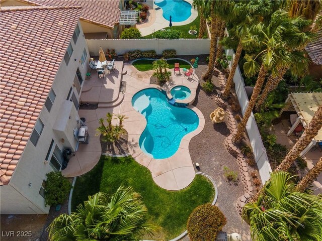 1430 October Oak Ave, Las Vegas, NV 89123 - view of swimming pool featuring a patio area, a fenced backyard, and a pool with connected hot tub