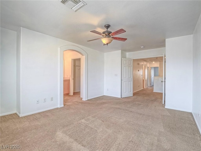 5929 Sleepy Fawn Dr, Las Vegas, NV 89142 - unfurnished room featuring visible vents, baseboards, arched walkways, ceiling fan, and carpet flooring