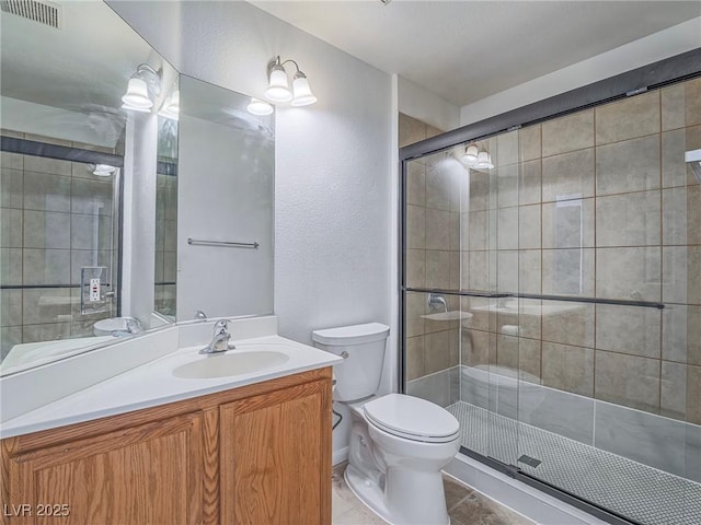 5929 Sleepy Fawn Dr, Las Vegas, NV 89142 - full bathroom with a shower stall, vanity, visible vents, and toilet