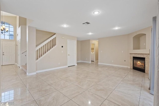 unfurnished living room with recessed lighting, a tile fireplace, stairway, visible vents, and light tile patterned flooring