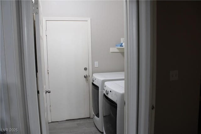 laundry room featuring washer and dryer and laundry area