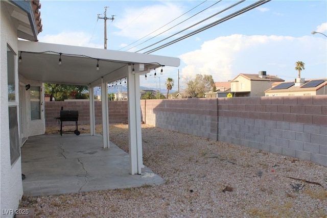 view of yard featuring a patio and a fenced backyard