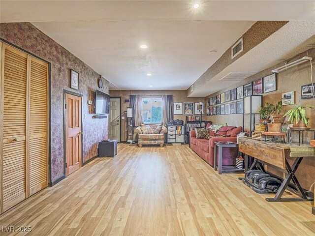 438 Las Casitas Way, Las Vegas, NV 89121 - living room featuring wood finished floors, wallpapered walls, and recessed lighting