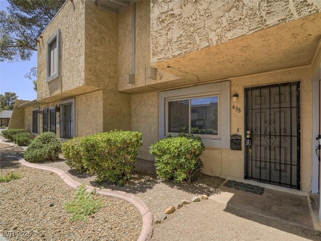 438 Las Casitas Way, Las Vegas, NV 89121 - view of exterior entry featuring stucco siding