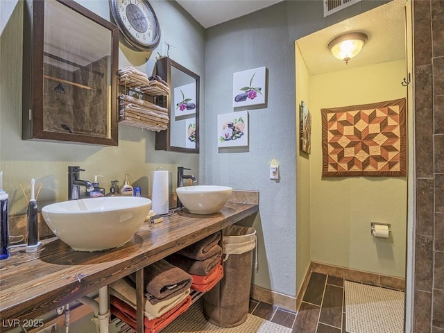 438 Las Casitas Way, Las Vegas, NV 89121 - bathroom featuring double vanity and tile patterned flooring
