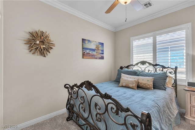 carpeted bedroom with a ceiling fan, baseboards, crown molding, and visible vents
