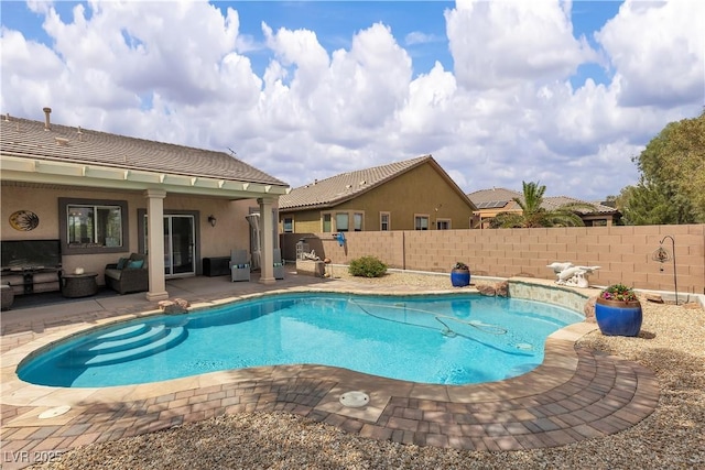view of swimming pool with a fenced in pool, a patio, and a fenced backyard