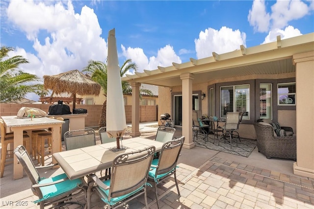 view of patio / terrace featuring outdoor dining area and fence