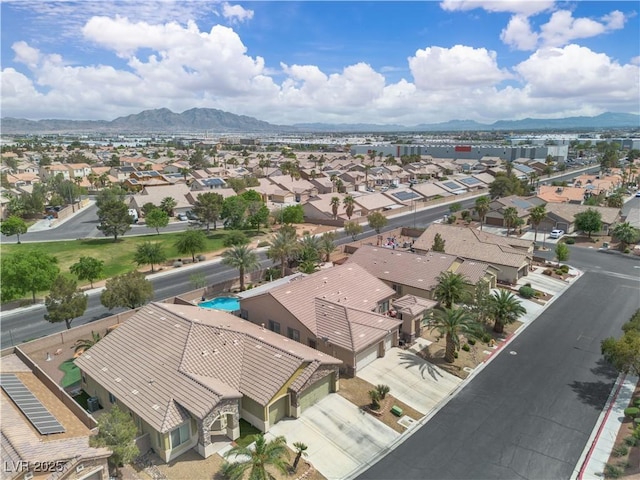 birds eye view of property with a residential view and a mountain view