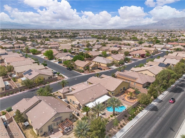 drone / aerial view with a residential view and a mountain view