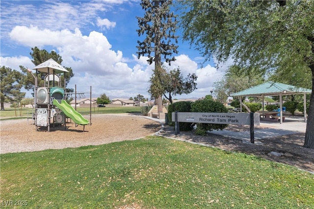 community jungle gym featuring a yard