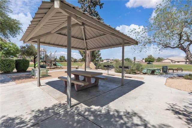 view of property's community with a gazebo, playground community, and a patio area