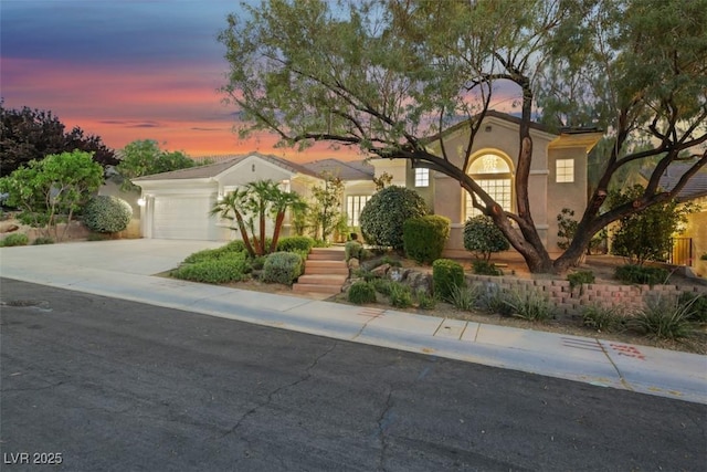 1805 Prichard Ave, Henderson, NV 89052 - mediterranean / spanish house featuring an attached garage, driveway, and stucco siding