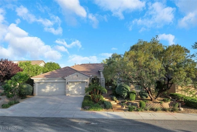 1805 Prichard Ave, Henderson, NV 89052 - view of front of house with a garage, stucco siding, a tiled roof, and concrete driveway