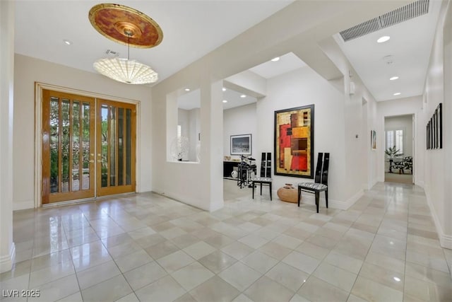 1805 Prichard Ave, Henderson, NV 89052 - entryway featuring visible vents, baseboards, light tile patterned floors, and a healthy amount of sunlight