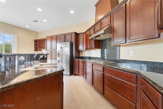 1111 Casa Palermo Cir, Henderson, NV 89011 - kitchen with backsplash, under cabinet range hood, visible vents, appliances with stainless steel finishes, and a sink