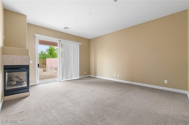 1111 Casa Palermo Cir, Henderson, NV 89011 - unfurnished living room featuring a large fireplace, visible vents, baseboards, and carpet floors