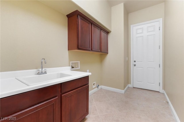 1111 Casa Palermo Cir, Henderson, NV 89011 - laundry area with baseboards, washer hookup, light tile patterned flooring, cabinet space, and a sink