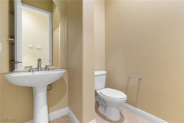 1111 Casa Palermo Cir, Henderson, NV 89011 - half bath featuring tile patterned floors, baseboards, and toilet