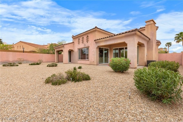1111 Casa Palermo Cir, Henderson, NV 89011 - back of house with a tile roof, fence, and stucco siding