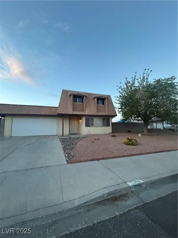 7200 Alta Dr, Las Vegas, NV 89145 - townhome / multi-family property featuring concrete driveway and an attached garage