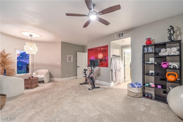 workout area with a ceiling fan, baseboards, carpet, and visible vents