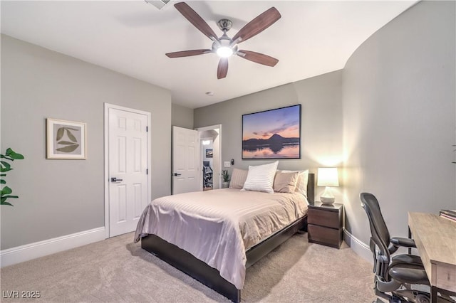 carpeted bedroom with baseboards and a ceiling fan