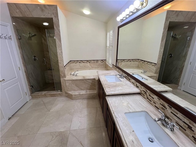 5554 Chicory Falls Ct, Las Vegas, NV 89148 - bathroom featuring a sink, a stall shower, vaulted ceiling, and a garden tub
