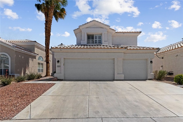 3024 Pismo Beach Dr, Las Vegas, NV 89128 - mediterranean / spanish-style home featuring driveway, stucco siding, and a tiled roof