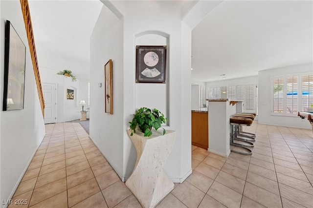 3024 Pismo Beach Dr, Las Vegas, NV 89128 - hall featuring light tile patterned flooring and arched walkways