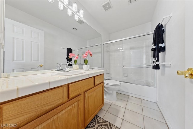 3024 Pismo Beach Dr, Las Vegas, NV 89128 - full bathroom featuring toilet, vanity, tile patterned flooring, and bath / shower combo with glass door